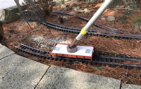 train track cleaner red box with wires metal bristles|dirty track cleaning.